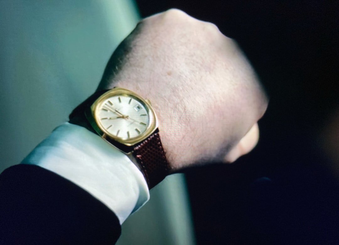 Modern unisex sports watch with ceramic bezel and stainless steel bracelet